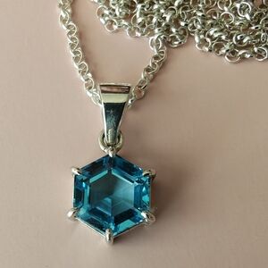 Elegant Silver Necklace with Blue Hexagon Pendant